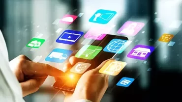 Person holding a smartphone with glowing app icons floating around.