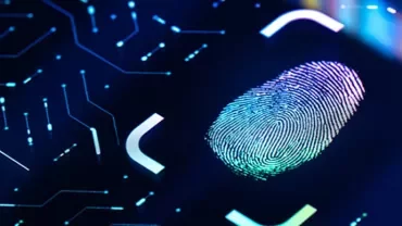 Close-up of a fingerprint on a glowing digital screen.
