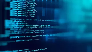 Close-up of computer screen displaying lines of blue code.
