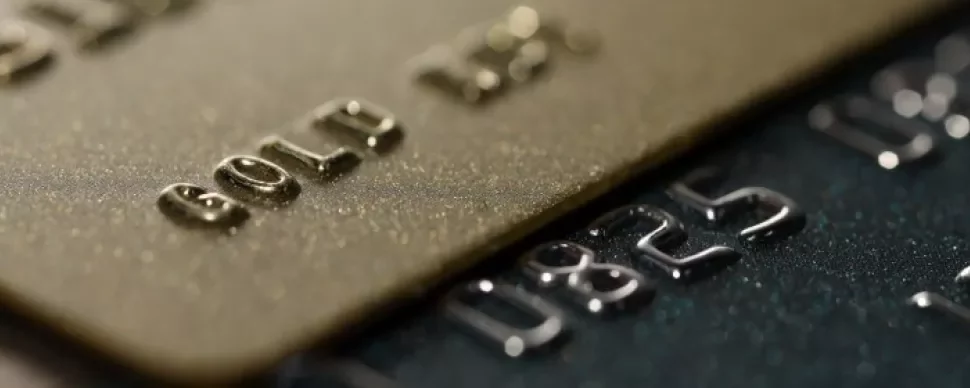  Multiple credit cards arranged side by side, highlighting their unique patterns and branding.