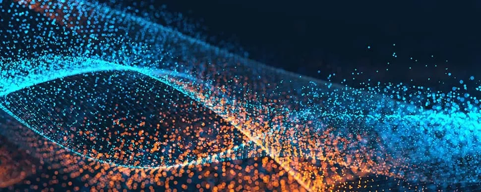 Colorful abstract image showing waves of blue and orange particles on a dark background.