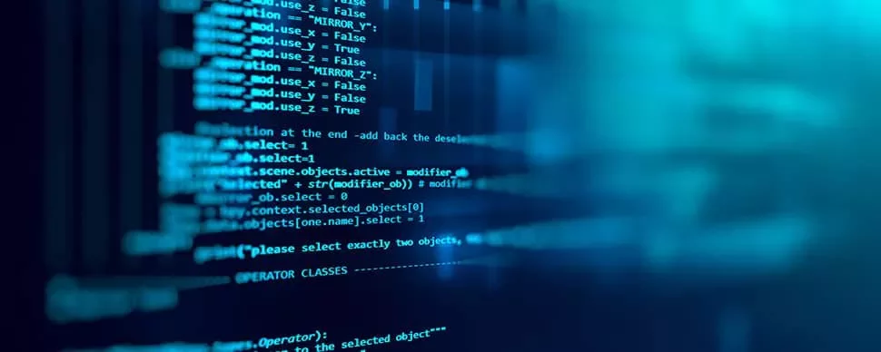 Close-up of computer screen displaying lines of blue code.