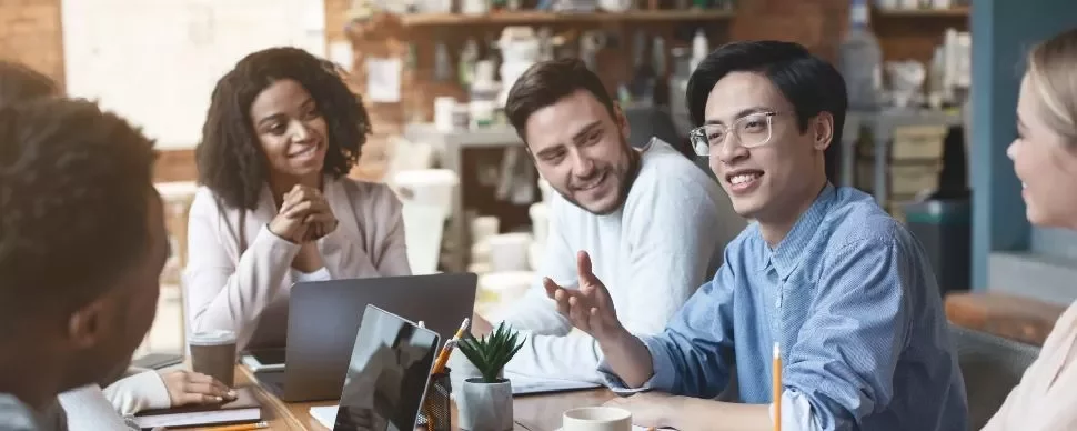 Group of professionals having a meeting in a cozy cafe.